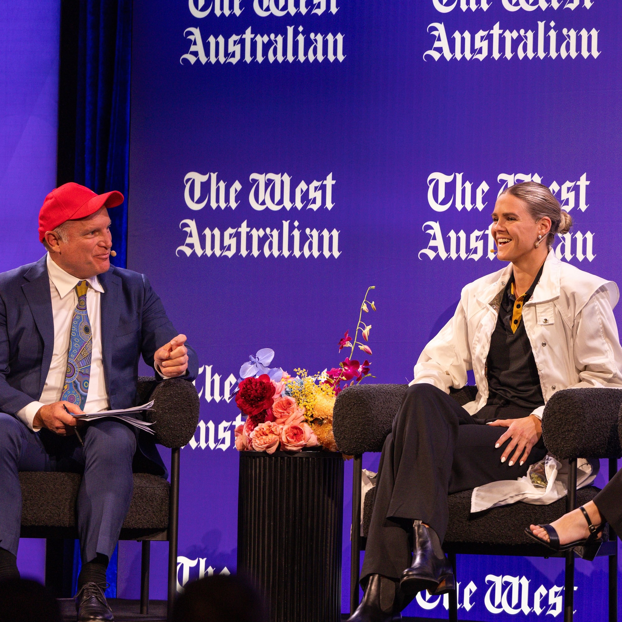 Shayna Jack in conversation on stage at a West Australian event, seated beside the host.